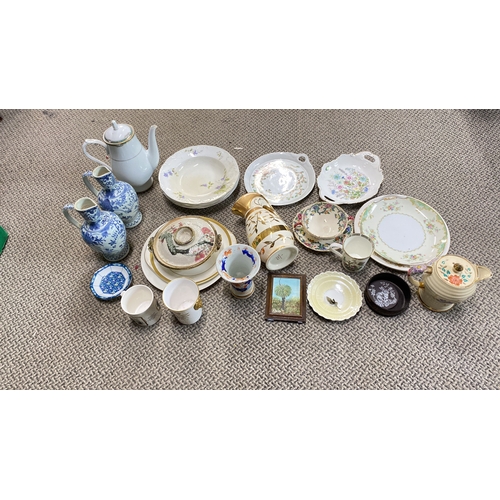 426 - Assorted vintage porcelain tablewares with floral and gilt designs, including plates, cups, jug, and... 