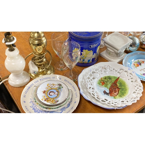 427 - Mixed lot including commemorative plates, brass and ceramic lamps, glassware, Tetley tea tin, blue a... 