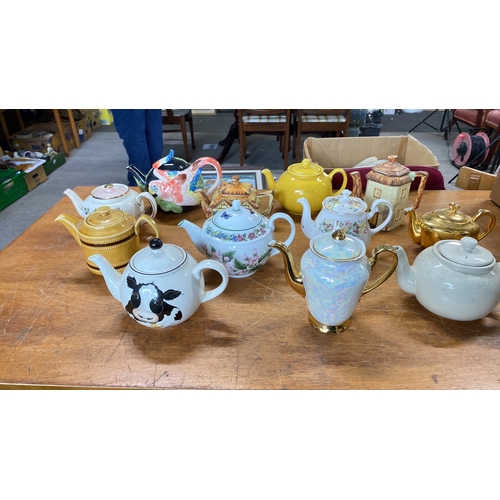 429 - Collection of teapots featuring various designs and themes, including floral and animal motifs.