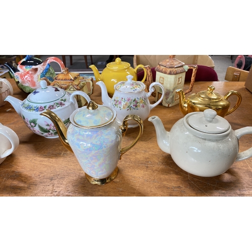 429 - Collection of teapots featuring various designs and themes, including floral and animal motifs.