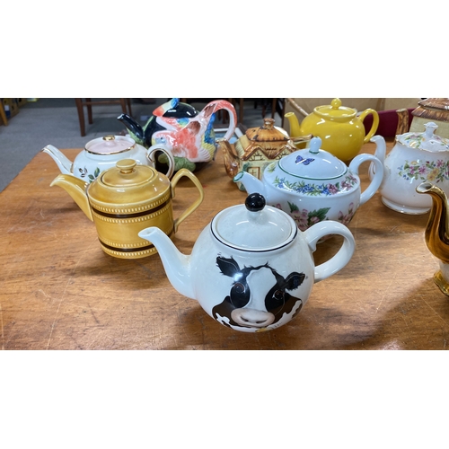 429 - Collection of teapots featuring various designs and themes, including floral and animal motifs.