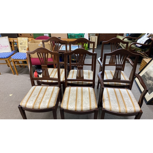 437 - Set of six mahogany dining chairs with carved backs and upholstered seats.