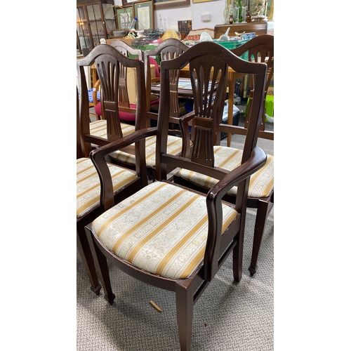 437 - Set of six mahogany dining chairs with carved backs and upholstered seats.