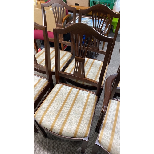 437 - Set of six mahogany dining chairs with carved backs and upholstered seats.