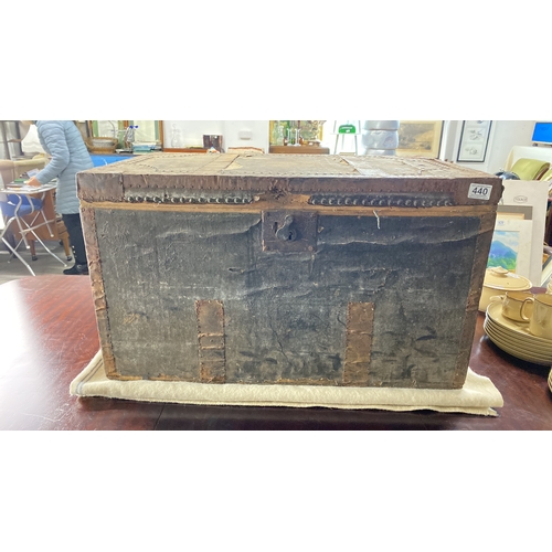 440 - Vintage wooden trunk with striped interior lining and metal accents. Features a lock mechanism. Appr... 