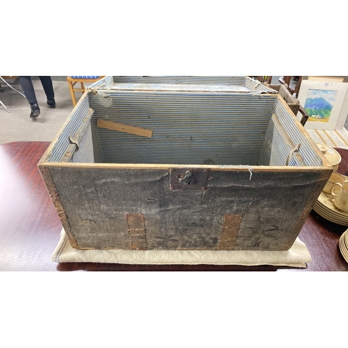 440 - Vintage wooden trunk with striped interior lining and metal accents. Features a lock mechanism. Appr... 