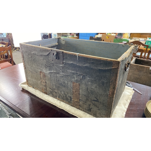 440 - Vintage wooden trunk with striped interior lining and metal accents. Features a lock mechanism. Appr... 