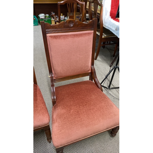 443 - Pair of Victorian mahogany chairs with carved details and pink velvet upholstery.