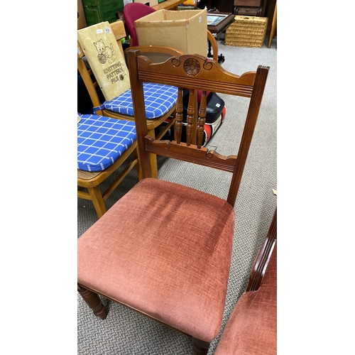 443 - Pair of Victorian mahogany chairs with carved details and pink velvet upholstery.