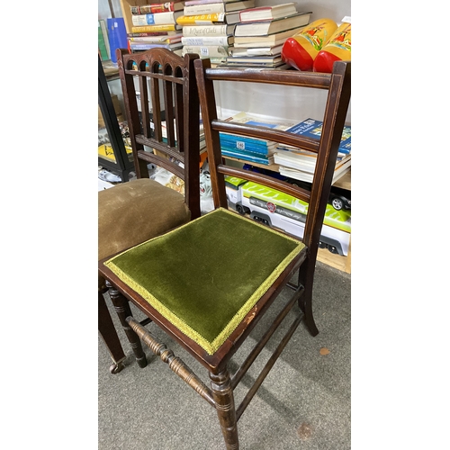 444 - Two vintage wooden chairs, featuring carved details and velvet upholstery.