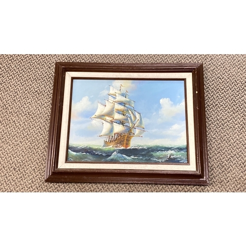 423 - Oil painting of a sailing ship on turbulent waters by artist with signature 