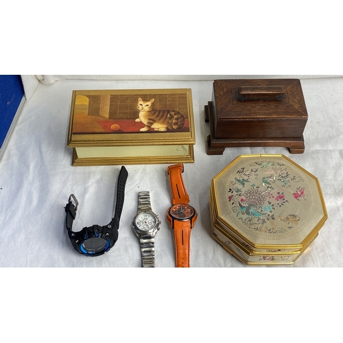 104 - Collection of decorative boxes and three men's watches, including a Jeep stainless steel and a Polic... 