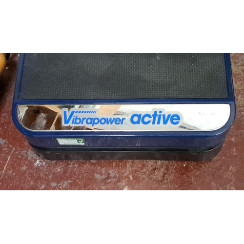 13 - Vibrapower Active vibration plate features a control panel and a sturdy platform.