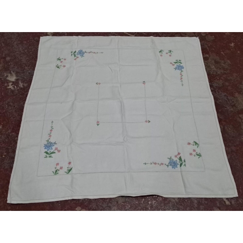 19 - Three vintage table cloths with decorative stitching.