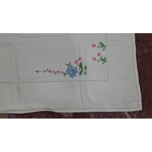 19 - Three vintage table cloths with decorative stitching.