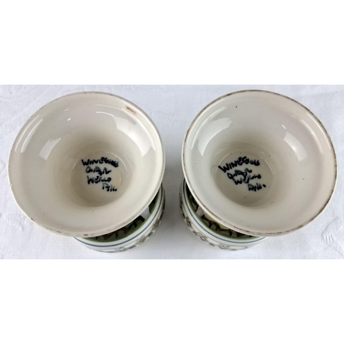 21 - Pair of ceramic goblets/candleholders, featuring a hand-painted geometric design with green accents.