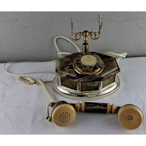 31 - Vintage Astral rotary telephone with a marbleized effect base and brass effect fittings, featuring a... 