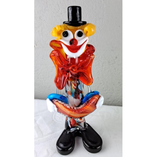 33 - Murano glass clown figurine with vibrant colours, including red, yellow, and blue. Accompanied by a ... 