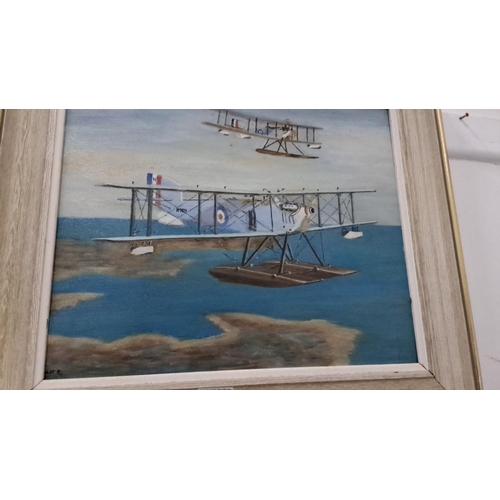 36 - Oil painting depicts vintage aircraft over water, framed. Signed at corner.