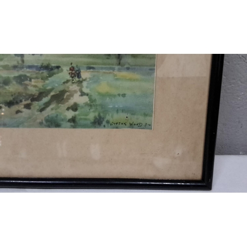 44 - Watercolour landscape painting. It depicts countryside scenery and is framed.