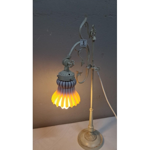 5 - Vintage wrought iron table lamp with an ornately designed arm and a fluted glass shade. Approximatel... 