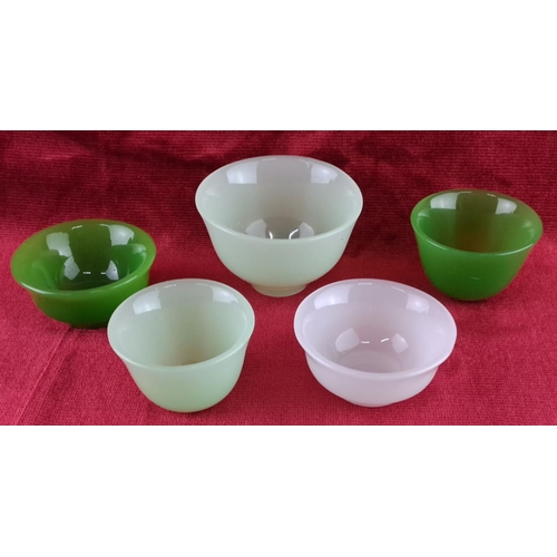 72 - Set of five antique jadeite glass bowls in differing shades of green and white. Translucent with a s... 