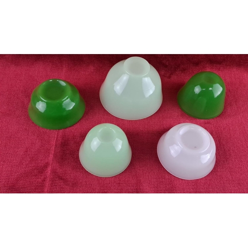 72 - Set of five antique jadeite glass bowls in differing shades of green and white. Translucent with a s... 