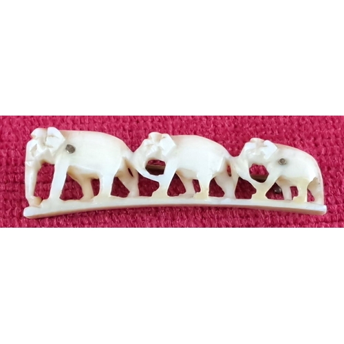 78 - Delicately carved bone pin featuring three elephants, secured with a metal pin back. From the early ... 