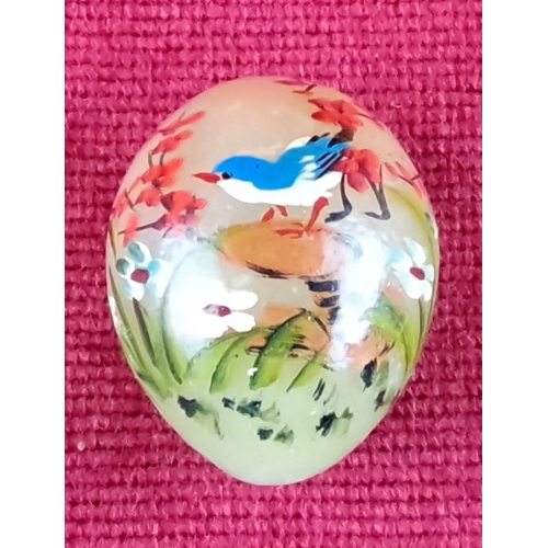 82 - Miniature Hand-painted glass cabochon featuring a blue bird amidst florals.