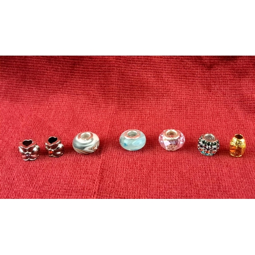 85 - Collection of varied charm beads, including silver-toned heart and floral designs, colorful glass, a... 