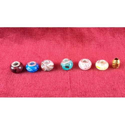 86 - Collection of 14 assorted charm beads, featuring glass and metal designs with various shapes and col... 