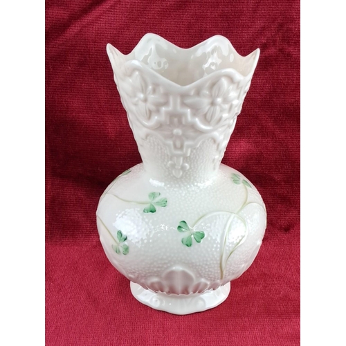 87 - Belleek porcelain vase with shamrock motif, featuring scalloped rim and embossed floral design. Mark... 