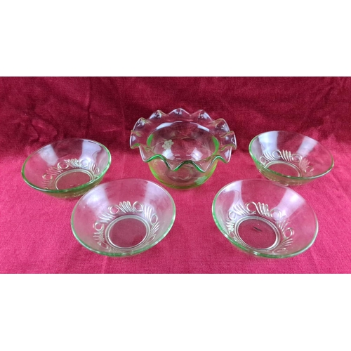 98 - Set of five green glass bowls, featuring a scalloped edge and decorative floral patterns. Mid-centur... 