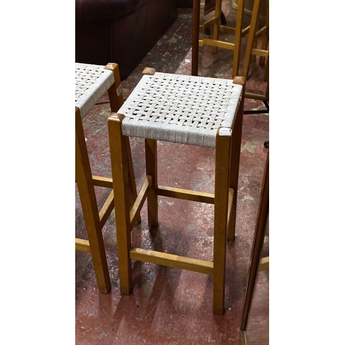 475 - Pair of Scandinavian-style woven stools with light wood frames. 69cm height