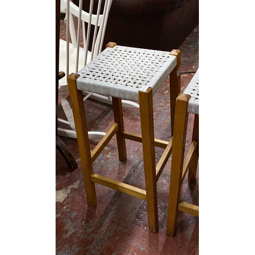 475 - Pair of Scandinavian-style woven stools with light wood frames. 69cm height