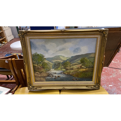 481 - Oil painting depicting a picturesque landscape with a river and rolling hills, 75cm x 60cm.