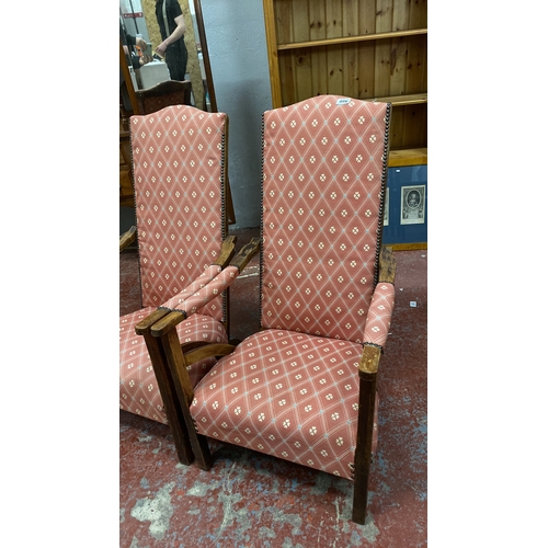 486 - Pair of antique high-back armchairs with wooden frames and patterned pink upholstery. Chair height 9... 