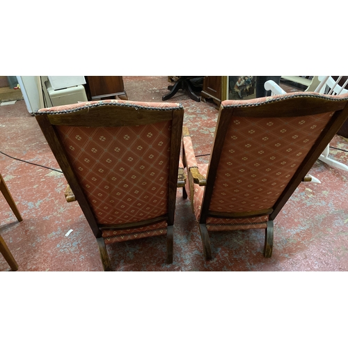 486 - Pair of antique high-back armchairs with wooden frames and patterned pink upholstery. Chair height 9... 