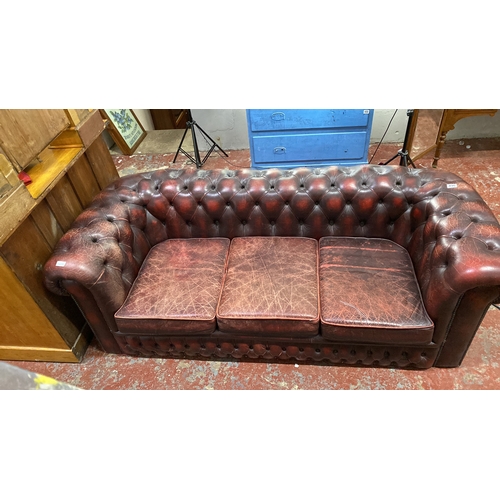 490 - Chesterfield red leather 3 seater sofa, featuring tufted back and arms. Measuring 185cm x 85cm x 65c... 