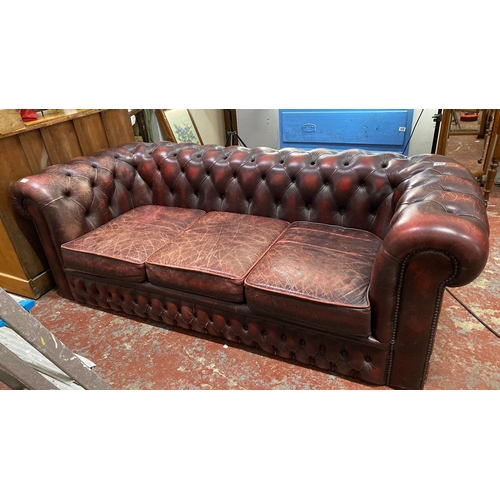 490 - Chesterfield red leather 3 seater sofa, featuring tufted back and arms. Measuring 185cm x 85cm x 65c... 