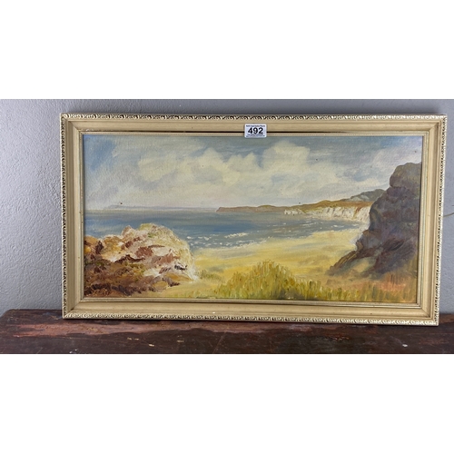 492 - Oil painting, coastal landscape showing White Rocks, Portrush, by P. C Adgey, 67cm x 37cm.