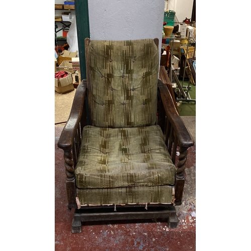 494 - Antique/ vintage Oak rocker armchair with green patterned upholstery, featuring turned arm supports ... 