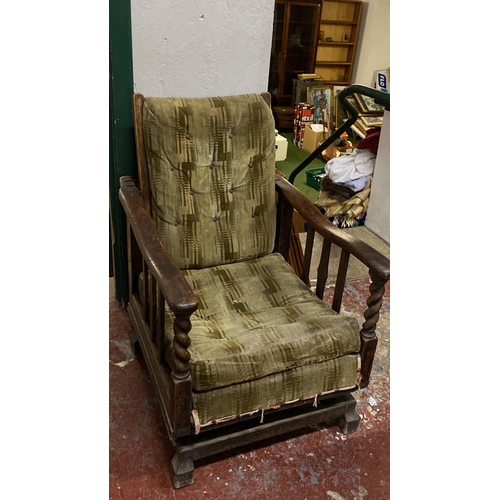 494 - Antique/ vintage Oak rocker armchair with green patterned upholstery, featuring turned arm supports ... 