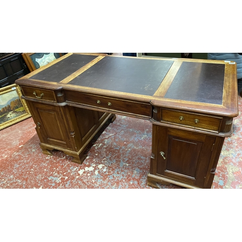 502 - Stunning antique style partners desk featuring a brown leather top with three panels, brass handles,... 