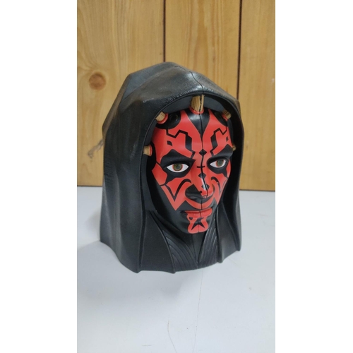 453 - Star Wars display case featuring Darth Maul with a detailed interior and a miniature figure.