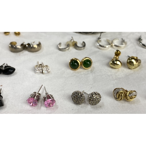 110 - Earring collection features gold, silver, and gemstone styles, including stud and hoop designs.