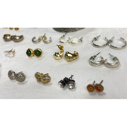 110 - Earring collection features gold, silver, and gemstone styles, including stud and hoop designs.