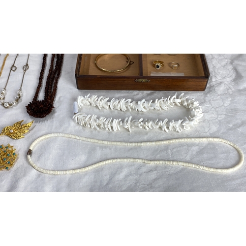 113 - Mixed jewellery lot including cufflinks, gold-tone blue gemstone ring,,” and various necklaces with ... 