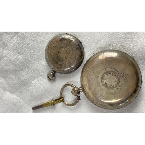 117 - Two antique silver cased pocket watches with key. Engraved cases, one features Roman numerals on a w... 