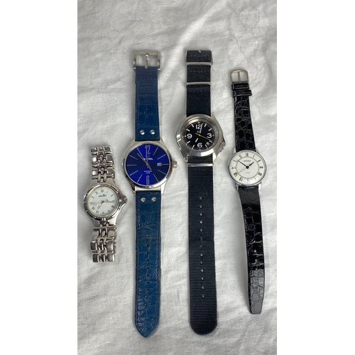 122 - Set of four wristwatches featuring diverse designs and brands including Ellesse, Sekonda, and Mvmt, ... 